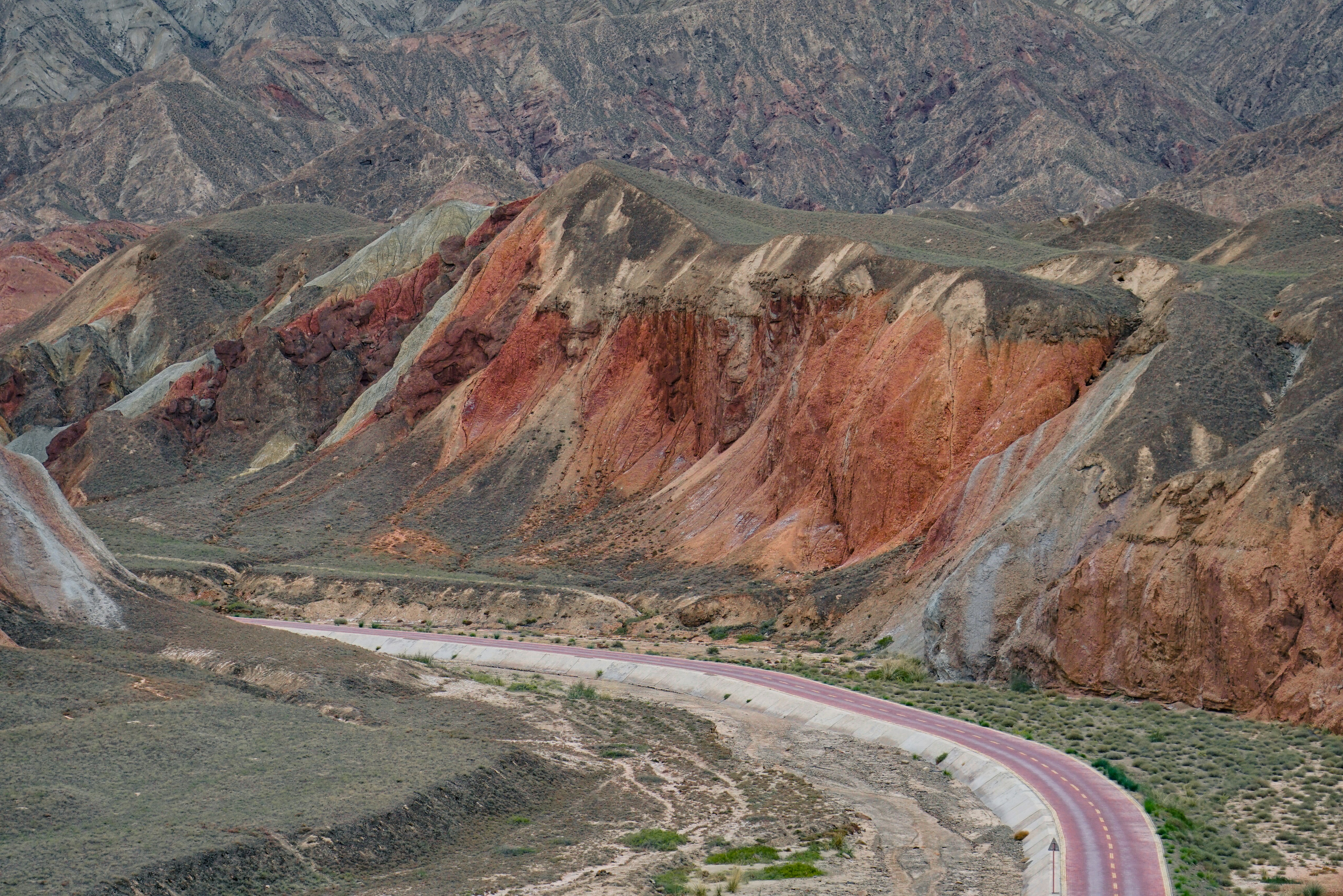 brown and gray mountains near road during daytime